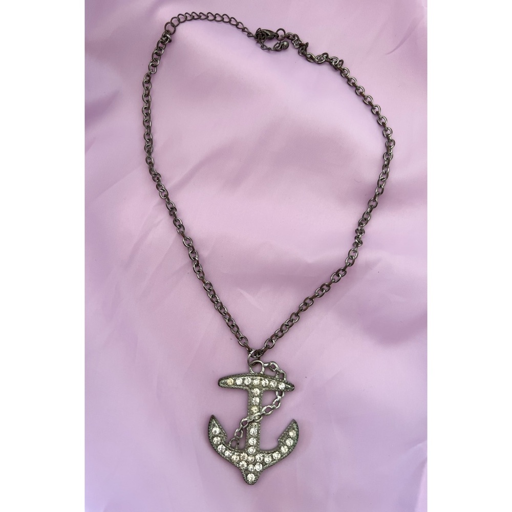 Jeweled anchor necklace.